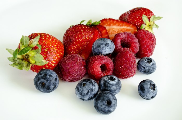 Strawberries, Raspberries, and Blueberries on a White Background