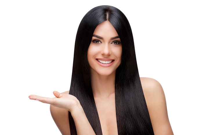 Smiling Woman with Long Shiny Hair on White Background