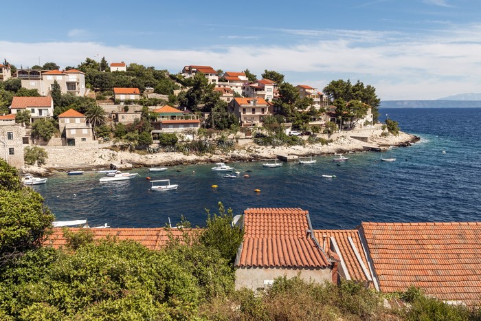 Houses and boats in a bay in Prigradica, Croatia