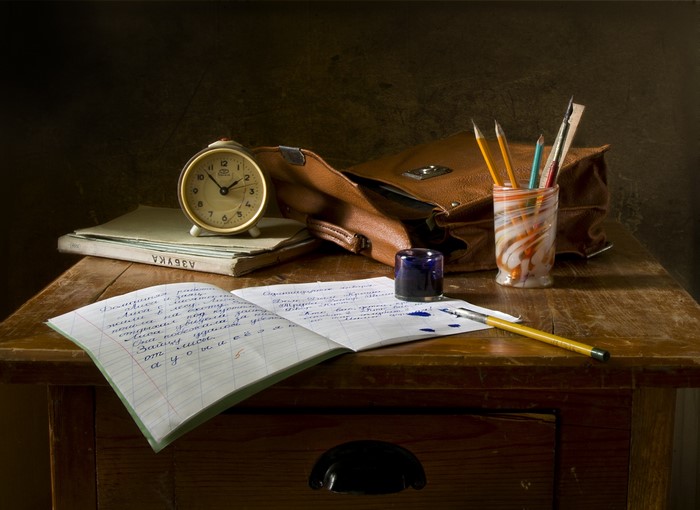 Still life of school supplies on a wooden table