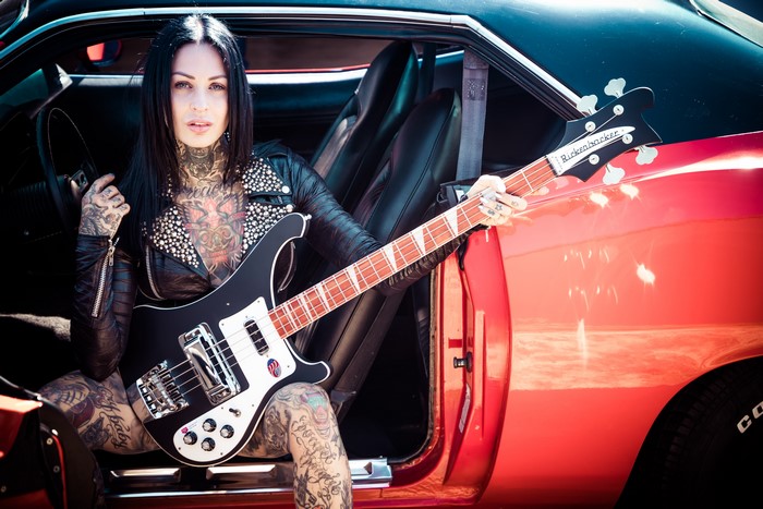 Femke Fatale with Rickenbacker Bass Guitar in Car