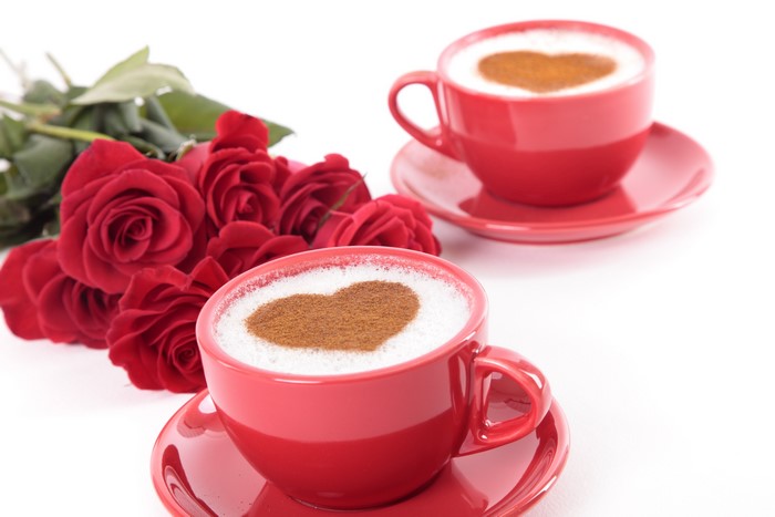 Two Red Coffee Cups with Heart Art and Roses