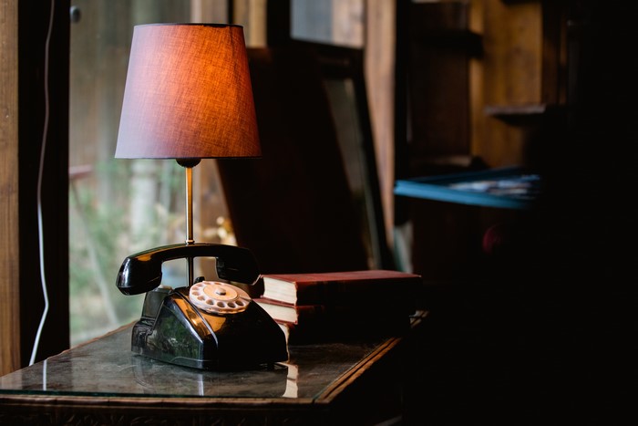 Retro lamp on a vintage telephone