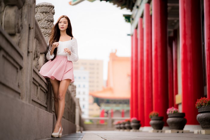 Asian Woman in Pink Skirt with Bokeh Background
