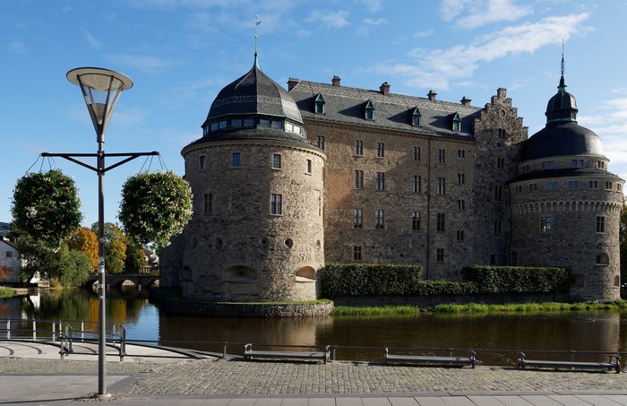 Orebro Castle and pond with street light, Sweden