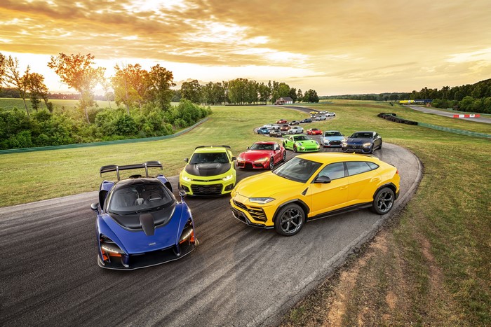 4K Many Sports Cars on a Racetrack