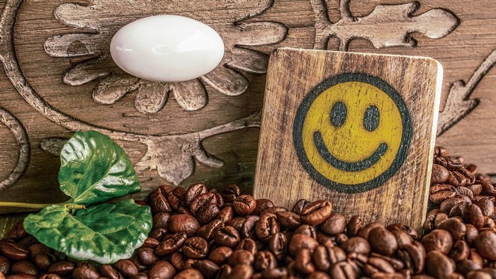Coffee beans with a smiley face and egg
