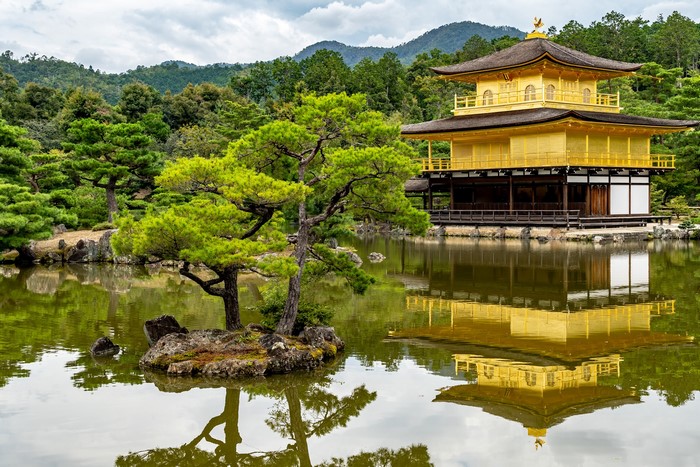 Kinkaku-ji Golden Pavilion reflected in pond, Kyoto, Japan