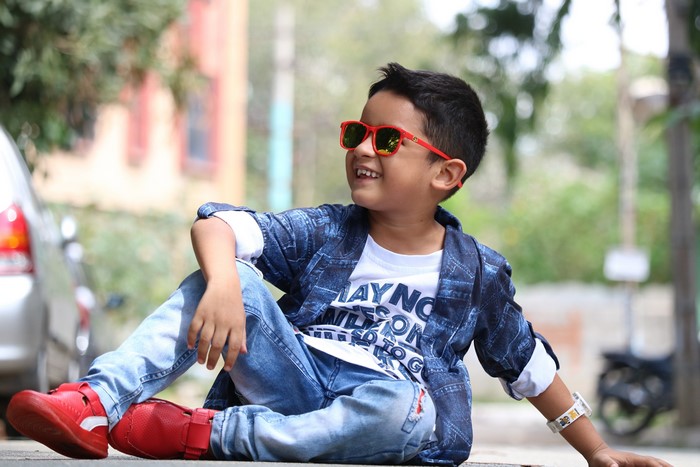 Smiling Boy in Red Shoes and Sunglasses 4K