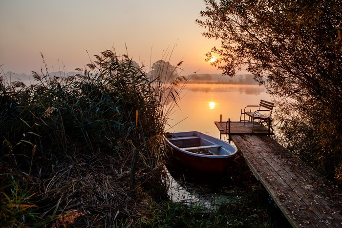 4K Lake Sunrise with Boat and Dock