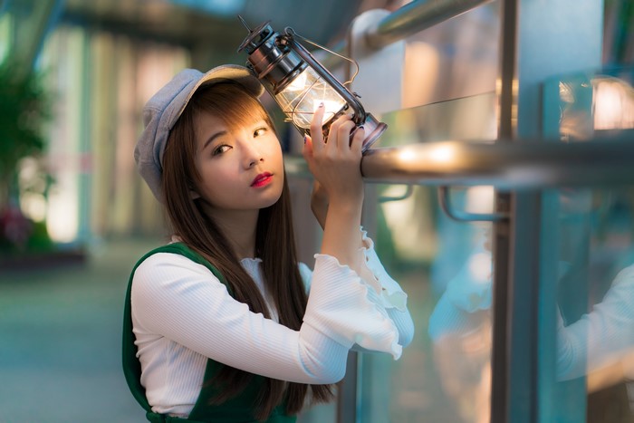 4K Portrait of Woman Holding Kerosene Lamp