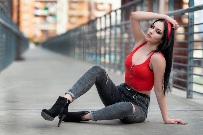 Brunette Woman Posing in Red Top and Jeans