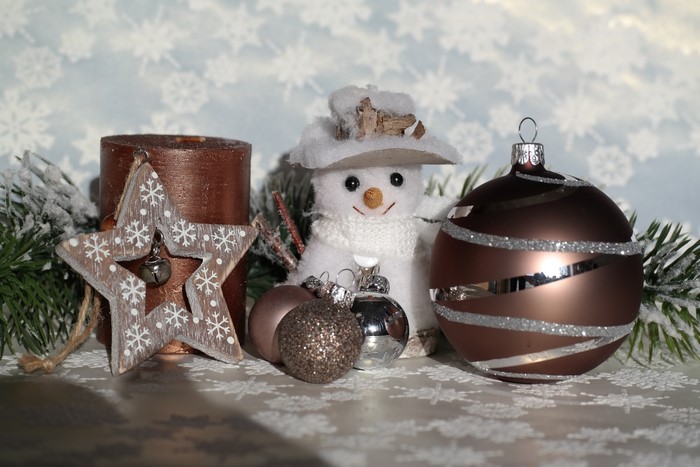 Christmas decorations with snowman, candle, and ornaments