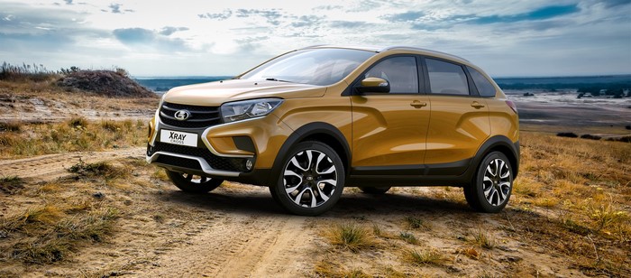 Lada XRAY Cross metallic car on a dirt road