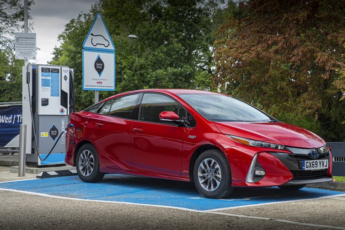 Red 2019 Toyota Prius Plug-in Hybrid at Charging Station