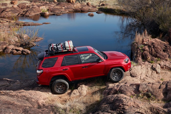 Red Toyota 4Runner Venture Edition SUV with roof rack
