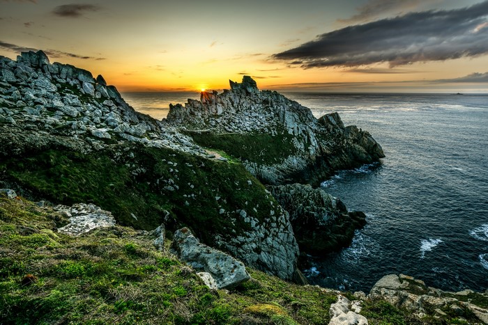Rocky coast of Brittany, France at sunset