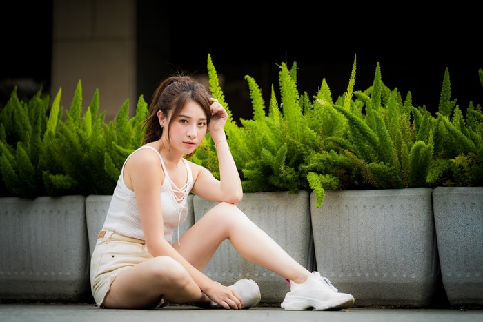 4K Asian Woman Sitting in White Outfit