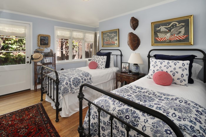 Bedroom with two beds and patriotic decor