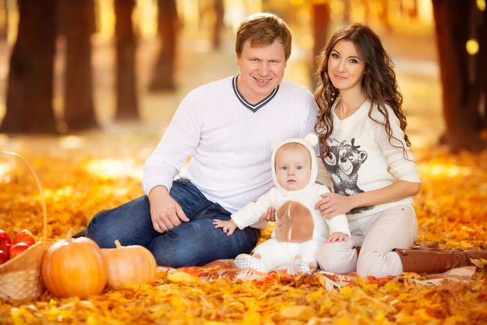 Family with Baby in Autumn Park