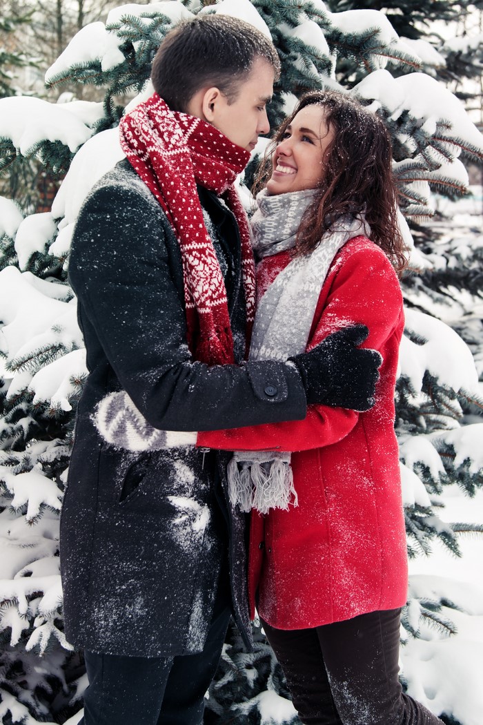 Couple hugging in the snow