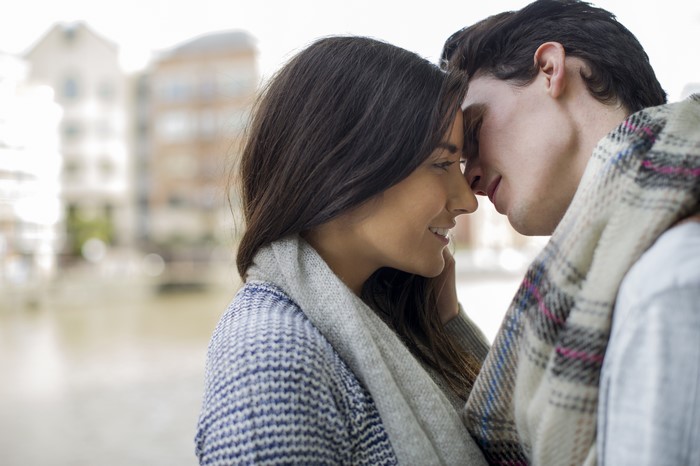Couple in love wearing scarves and sweaters