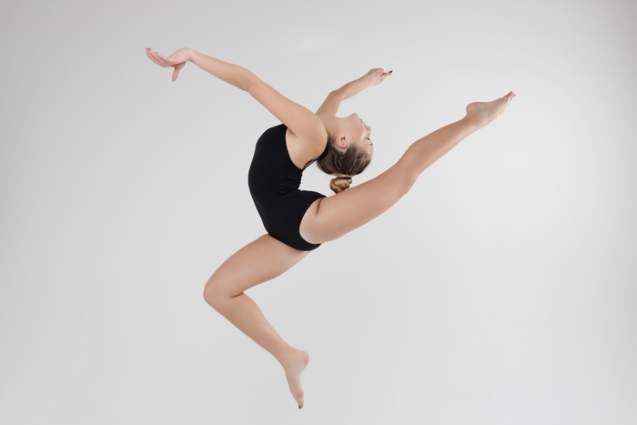 4K Gymnastics Leap with Gray Background