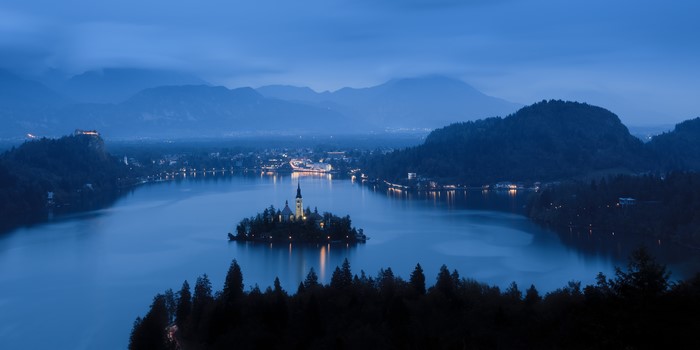 Lake Bled island church and castle at dusk, Slovenia