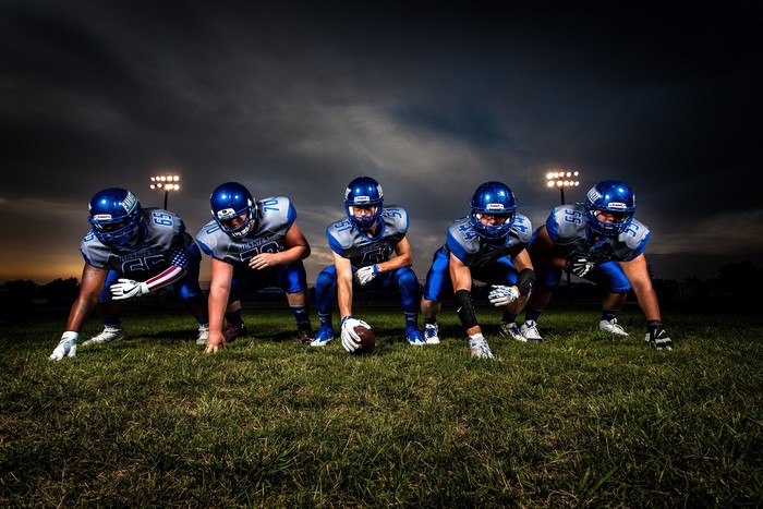 American football players in uniform on field