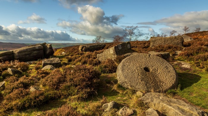 Millstone and boulders in Peak District, England