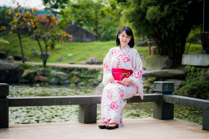 Woman in Kimono Sitting by Pond