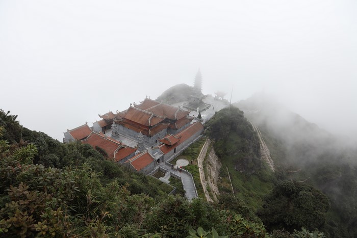 Buddhist temple on Mount Fansipan in fog