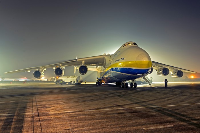 Antonov An-225 Mriya transport aircraft on tarmac at night