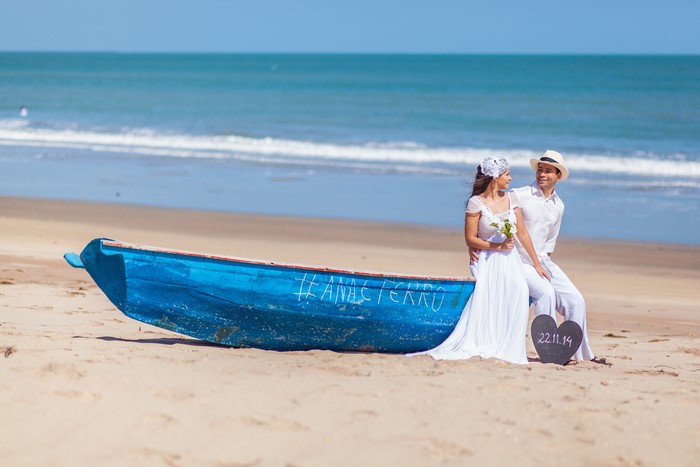 Bride and Groom on a Boat at the Beach