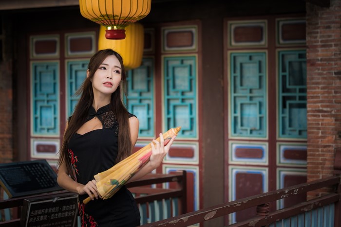 Elegant Woman in Black Dress Holding Umbrella 4K
