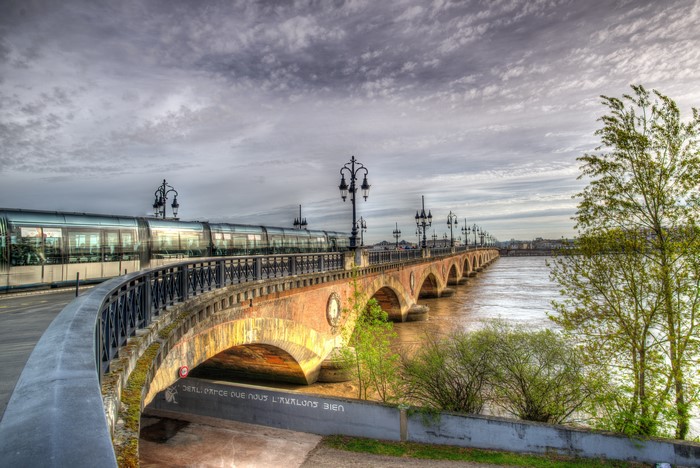 Pont de Pierre bridge with tram in Bordeaux, France