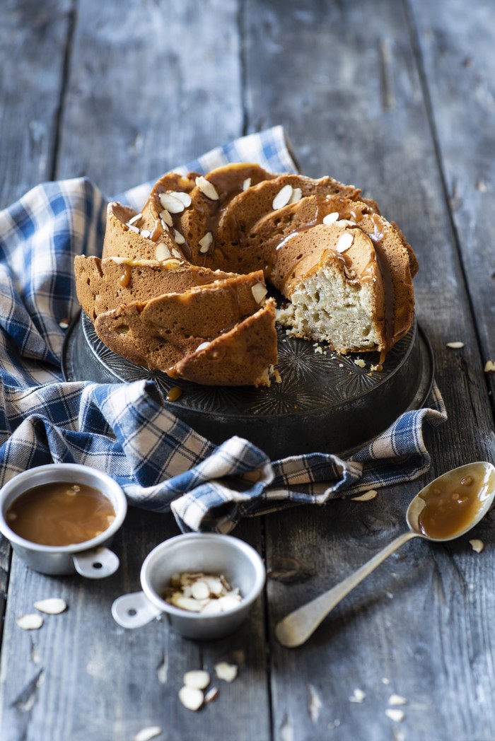 Bundt cake with caramel sauce and almonds