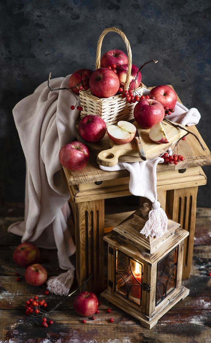 Apples in a basket with a lantern
