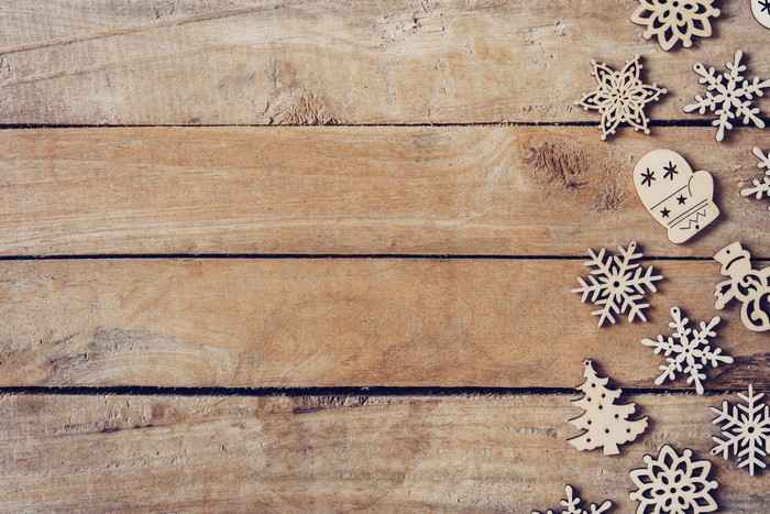 Christmas wooden ornaments on wood planks