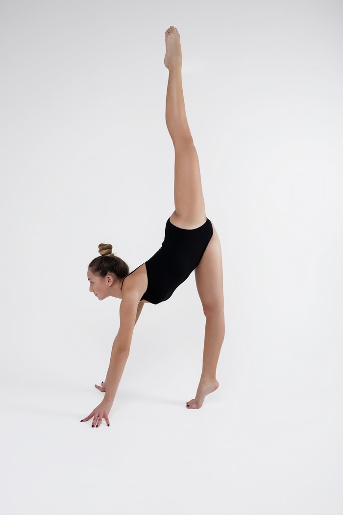 4K Gymnastics Stretching Pose on Gray Background