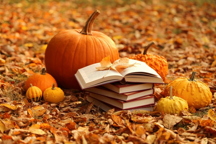 Pumpkins and Books on Autumn Foliage