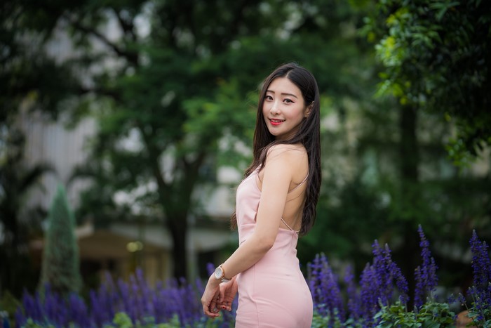 Asian woman in pink dress with flowers