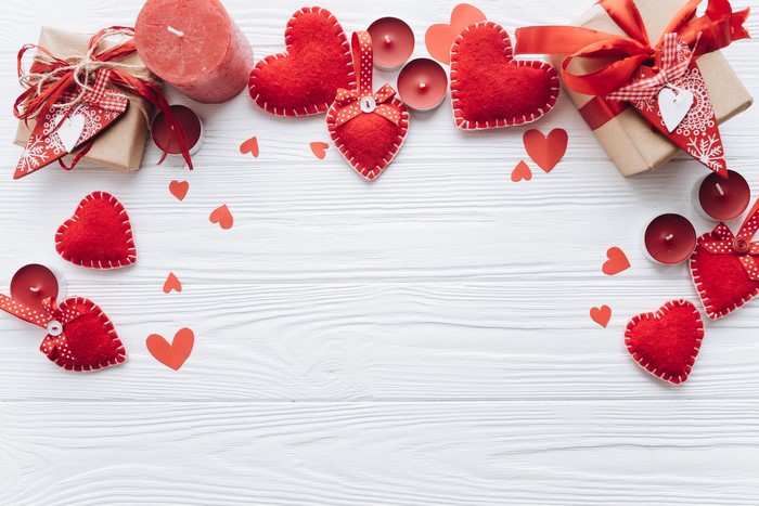 Valentine's Day Red Hearts Candles and Gifts on Wood