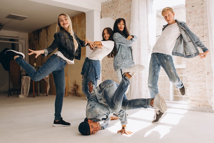 Group of young people dancing in a studio