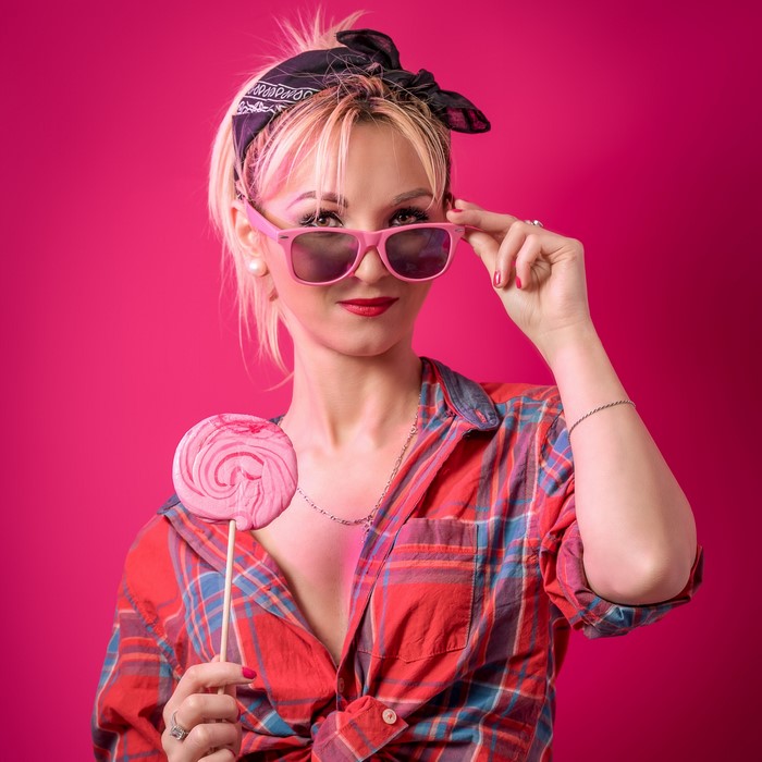 Blonde woman with lollipop and sunglasses