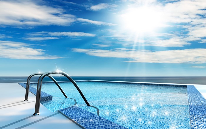 Infinity Pool with Ocean View Under Sunny Sky