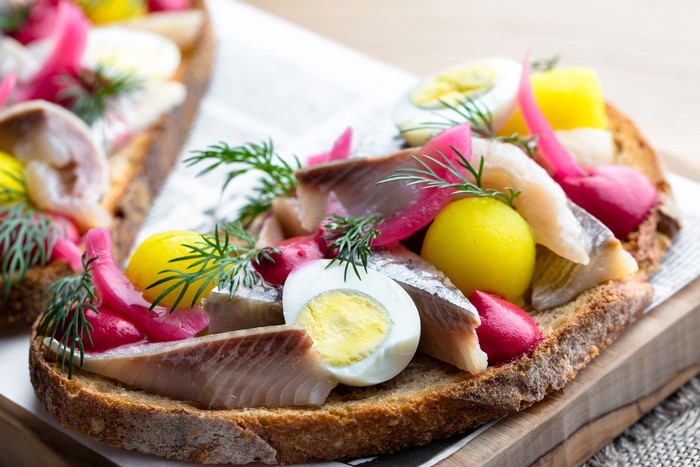 Smørrebrød with herring, egg, and dill