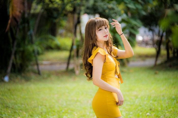 4K Portrait of Woman in Yellow Dress Outdoors