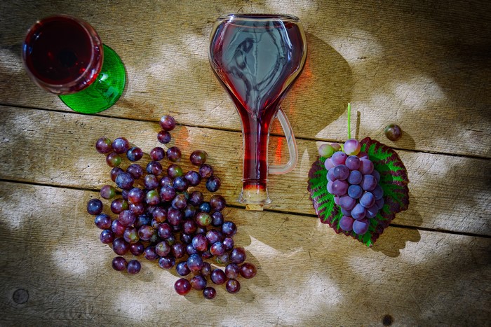 Grapes and Wine in a Bottle and Glass