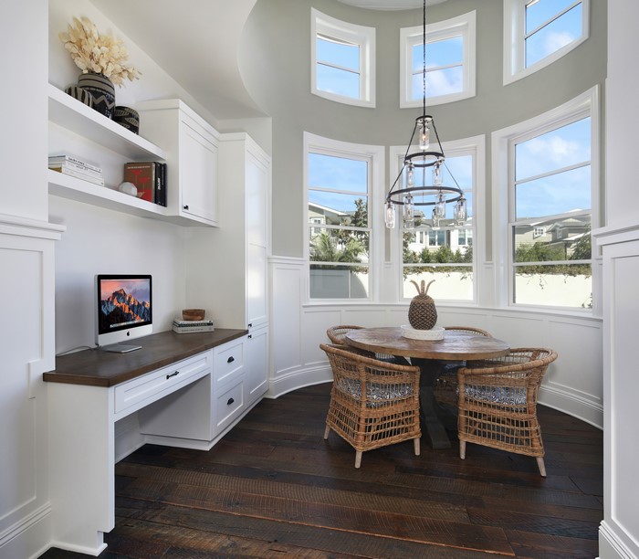 Interior design with desk, chairs, and chandelier